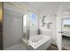 Bathroom features a separate tub and shower with glass enclosure at 42225 Kingsmill Cir, Elizabeth, CO 80107