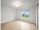 Cozy bedroom featuring hardwood floors, bright light, and neutral decor at 42225 Kingsmill Cir, Elizabeth, CO 80107