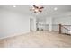 Spacious bonus room features hardwood flooring, ceiling fan, and stair access at 42225 Kingsmill Cir, Elizabeth, CO 80107