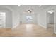 Large bonus room boasts hardwood floors and natural light from the large window at 42225 Kingsmill Cir, Elizabeth, CO 80107