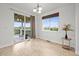 Bright dining area features a sliding glass door to the deck and a view of the green outdoors at 42225 Kingsmill Cir, Elizabeth, CO 80107