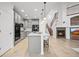 Open kitchen layout featuring a center island, stainless steel appliances, and adjacent living room at 42225 Kingsmill Cir, Elizabeth, CO 80107