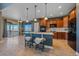 Modern kitchen with stainless steel appliances, a large island, and bar seating at 42225 Kingsmill Cir, Elizabeth, CO 80107