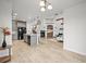 Spacious living room boasts a fireplace, high ceilings, and is adjacent to the modern kitchen at 42225 Kingsmill Cir, Elizabeth, CO 80107