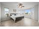 Bright main bedroom features lots of natural light and a ceiling fan at 42225 Kingsmill Cir, Elizabeth, CO 80107