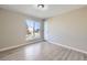 Bedroom with vinyl plank flooring, a bright window, and neutral walls at 2522 W 100Th Ave, Federal Heights, CO 80260