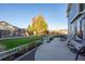 Spacious backyard with green lawn, mature trees, and a patio area, ideal for relaxation and outdoor enjoyment at 4797 Longs Peak St, Brighton, CO 80601