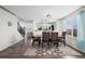 Open dining room showcasing a spacious layout, modern finishes, and seamless flow to other areas of the home at 4797 Longs Peak St, Brighton, CO 80601