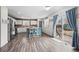 Well-lit kitchen featuring modern appliances, ample cabinet space, and a convenient breakfast bar at 4797 Longs Peak St, Brighton, CO 80601