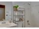 Neutral bathroom with shower and bath combination and storage for towels at 9659 Autumnwood Pl, Highlands Ranch, CO 80129