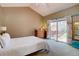 Serene main bedroom with a sliding glass door leading to an outdoor deck area at 9659 Autumnwood Pl, Highlands Ranch, CO 80129