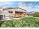 Spacious backyard features a well-maintained lawn, wooden deck with ramp and a convenient bicycle rack at 3656 W 77Th Ave, Westminster, CO 80030