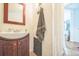 Clean bathroom with sink, vanity, mirror, and a towel at 3656 W 77Th Ave, Westminster, CO 80030