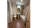 Tiled bathroom featuring a shower-tub combo, pedestal sink, and toilet at 3656 W 77Th Ave, Westminster, CO 80030