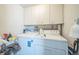 Practical laundry room with washer, dryer, and ample cabinet storage at 3656 W 77Th Ave, Westminster, CO 80030