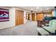 Finished basement with closet space, carpeted floors, and a desk with office chair at 17595 E Wesley Pl, Aurora, CO 80013