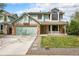 Charming two-story home with brick accents, well-manicured lawn, and welcoming curb appeal at 17595 E Wesley Pl, Aurora, CO 80013