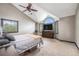 Spacious primary bedroom with vaulted ceilings, large windows, and a ceiling fan at 17595 E Wesley Pl, Aurora, CO 80013