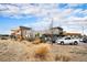 Exterior view showcasing parking and the recreational building with a slide feature at 17595 E Wesley Pl, Aurora, CO 80013