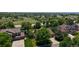 Aerial view shows this home with a yard, pool, and surrounding neighborhood at 1936 E 144Th Dr, Thornton, CO 80602