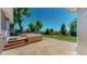 This backyard features a wooden deck, patio and lush green lawn at 1936 E 144Th Dr, Thornton, CO 80602
