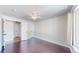 Bedroom featuring hardwood floors, neutral walls, and ceiling fan at 1936 E 144Th Dr, Thornton, CO 80602