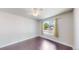Bedroom featuring hardwood floors, neutral walls, and a bright window at 1936 E 144Th Dr, Thornton, CO 80602