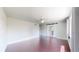 Spacious bedroom featuring hardwood floors, barn door to bathroom, and ceiling fan at 1936 E 144Th Dr, Thornton, CO 80602