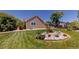 Exterior view of a home featuring lush grass and landscaping at 1936 E 144Th Dr, Thornton, CO 80602