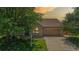 Inviting brick home features a well-manicured lawn and attached two-car garage at 1936 E 144Th Dr, Thornton, CO 80602