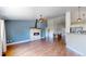 Inviting living room with a charming brick fireplace and ceiling fan at 1936 E 144Th Dr, Thornton, CO 80602