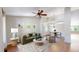 Bright living room with vaulted ceilings, hardwood floors, and stylish furnishings at 1936 E 144Th Dr, Thornton, CO 80602