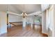 Elegant living room featuring wood floors, a chandelier and ample natural light at 1936 E 144Th Dr, Thornton, CO 80602