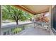 Inviting front porch with white railing and a serene view of the neighborhood at 1936 E 144Th Dr, Thornton, CO 80602
