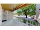 Charming front porch offering a peaceful view of the tree-lined street at 1936 E 144Th Dr, Thornton, CO 80602