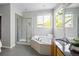 Beautiful bathroom with a large tub, a shower, and a large vanity at 10511 Jaguar Gln, Lone Tree, CO 80124