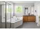 Luxurious bathroom with a large tub, a shower, and a dual sink vanity at 10511 Jaguar Gln, Lone Tree, CO 80124