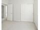 Bedroom with light gray walls and white doors with sliding closet doors at 10511 Jaguar Gln, Lone Tree, CO 80124