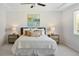 Beautiful bedroom with a ceiling fan, a large bed and matching end tables with lamps at 10511 Jaguar Gln, Lone Tree, CO 80124