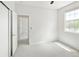 Bedroom with an open closet and view to the outside at 10511 Jaguar Gln, Lone Tree, CO 80124
