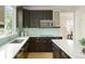 Modern kitchen with stainless steel appliances, light countertops, and a stylish backsplash at 10511 Jaguar Gln, Lone Tree, CO 80124