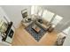 Aerial view of living room featuring vaulted ceilings, fireplace and comfortable furniture at 10511 Jaguar Gln, Lone Tree, CO 80124