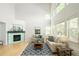 Cozy living room with large windows and modern fireplace at 10511 Jaguar Gln, Lone Tree, CO 80124