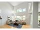 Living room showcasing vaulted ceilings, lots of windows, and open floor plan layout at 10511 Jaguar Gln, Lone Tree, CO 80124