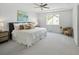 Open and bright main bedroom with a ceiling fan, and neutral colors at 10511 Jaguar Gln, Lone Tree, CO 80124