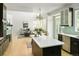 Open floor plan showcases seamless transition from kitchen to living area, with high ceilings and natural light at 10511 Jaguar Gln, Lone Tree, CO 80124