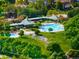 An aerial view of the community pool with ample seating and well-maintained landscaping at 10511 Jaguar Gln, Lone Tree, CO 80124