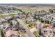 Stunning aerial view of the neighborhood with mature trees, community tennis courts, and easy highway access at 2885 W 115Th Dr, Denver, CO 80234