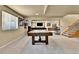 Finished basement featuring a pool table, comfortable seating area, and sports memorabilia for entertainment and relaxation at 2885 W 115Th Dr, Denver, CO 80234
