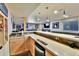Stylish basement bar boasts ample counter space, modern fixtures, and convenient mini-fridge at 2885 W 115Th Dr, Denver, CO 80234